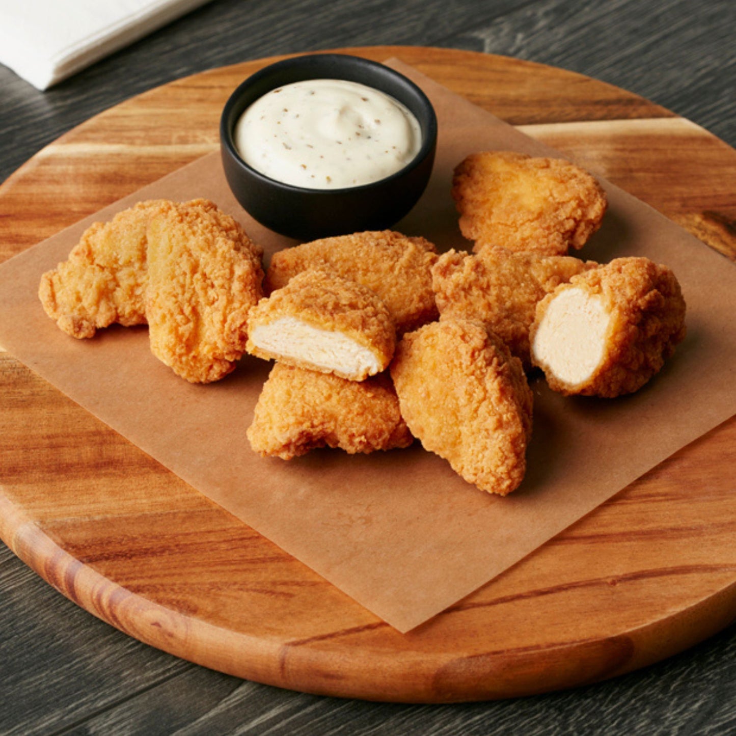 Cooked, breaded chicken breast bites